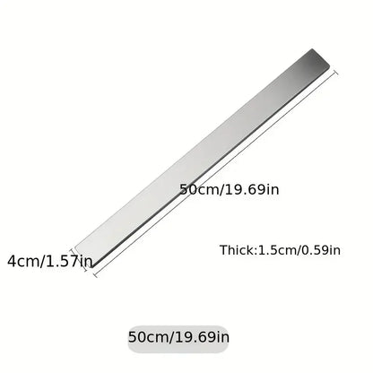 Stainless steel magnetic knife holder wall mount by Maison Verdane holding kitchen knives securely in a modern kitchen.