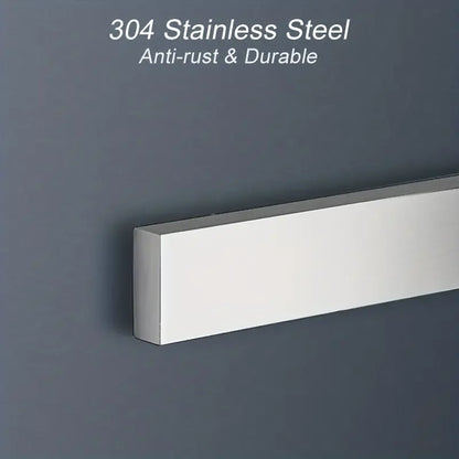 Stainless steel magnetic knife holder wall mount by Maison Verdane, holding kitchen knives on a modern kitchen wall.
