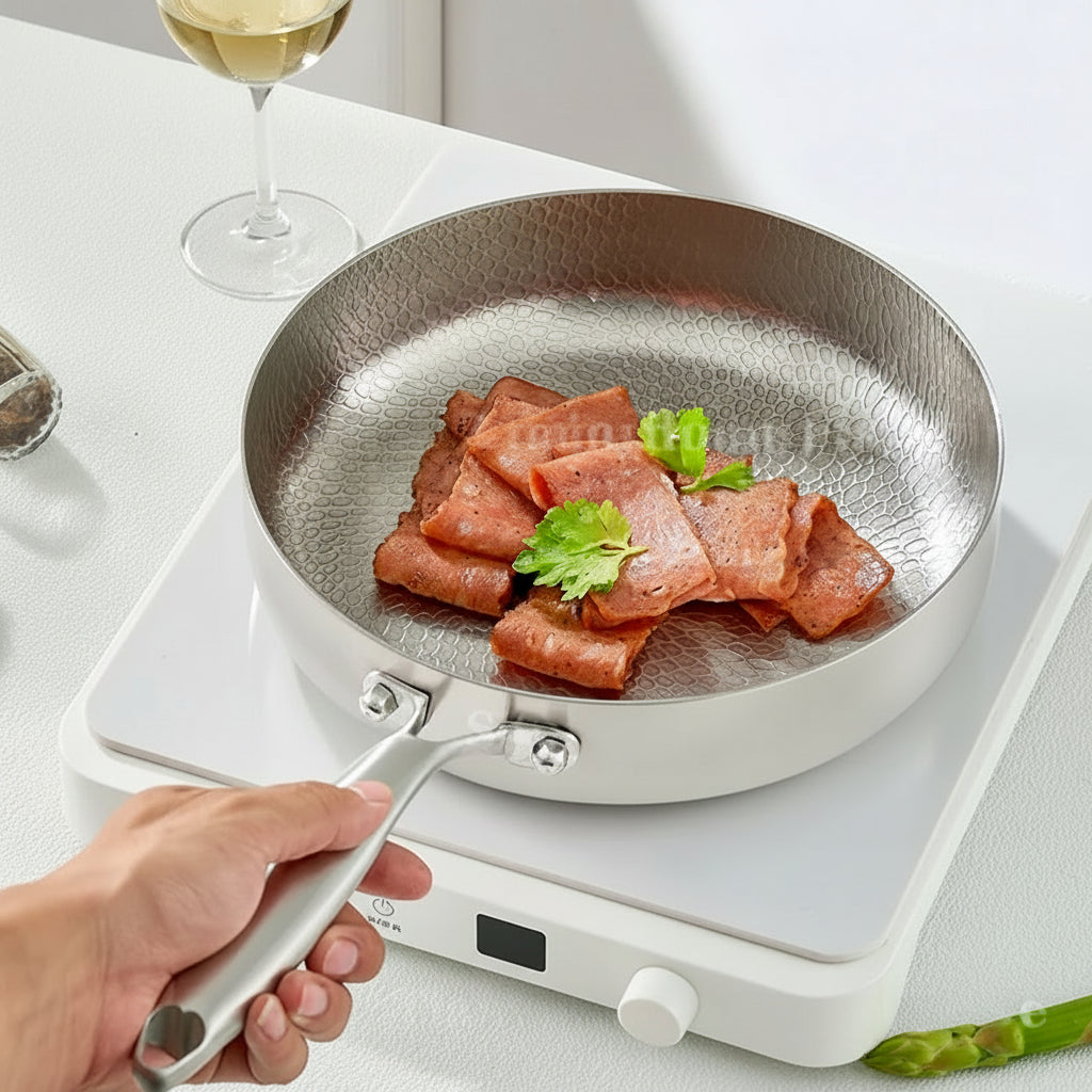 Maison Verdane non-stick stainless steel frying pan with uncoated surface, suitable for gas and induction stovetops.
