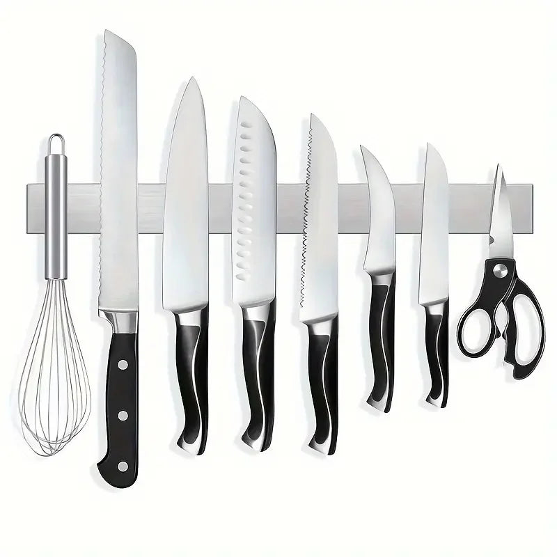 Stainless steel wall-mounted magnetic knife holder from Maison Verdane displays kitchen knives securely and neatly.