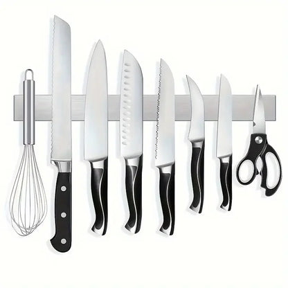 Stainless steel wall-mounted magnetic knife holder from Maison Verdane displays kitchen knives securely and neatly.