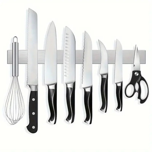 Stainless steel wall-mounted magnetic knife holder from Maison Verdane displays kitchen knives securely and neatly.