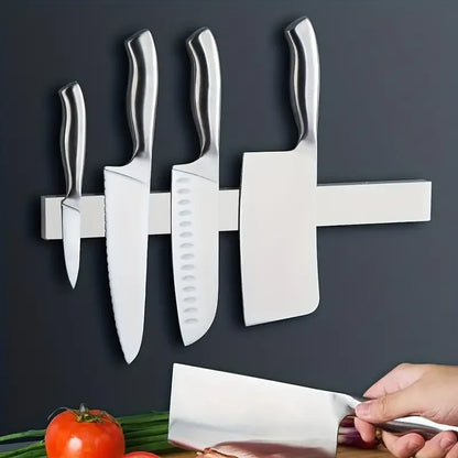 Stainless steel wall mount magnetic knife holder by Maison Verdane with multiple slots for kitchen knives.