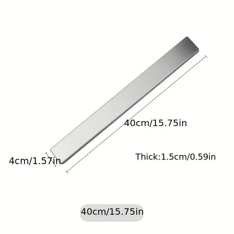Stainless steel wall-mounted magnetic knife holder by Maison Verdane with space for kitchen knives and utensils.