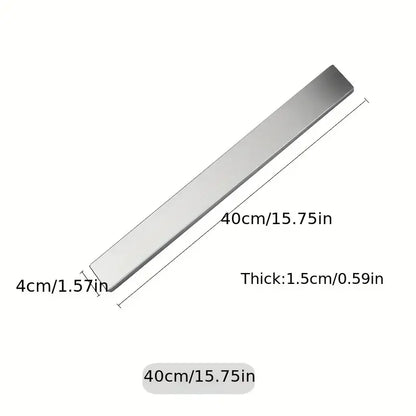 Stainless steel wall-mounted magnetic knife holder by Maison Verdane with space for kitchen knives and utensils.